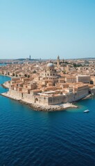 Obraz premium Aerial View of Coastal City with Historic Architecture and Blue Water