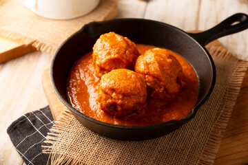 Meatballs in red chipotle chili and tomato sauce, ground pork or beef stuffed with cheese. A very popular homemade food recipe in Mexico and other countries, commonly served with rice.