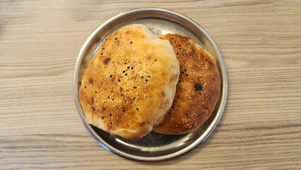 Small sesame-coated  baloon breads, commonly enjoyed during Turkish breakfasts and Ramadan meals.