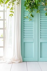 Fototapeta premium Dreamy garden window with sheer curtains and teal shutters evokes a nostalgic atmosphere in a tranquil French setting