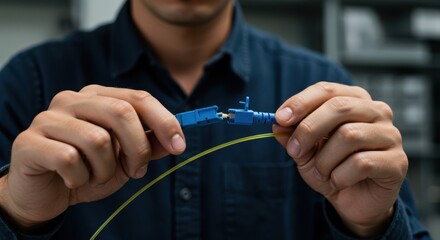 Skilled Fiber Optic Engineer Working on FTTx Cable