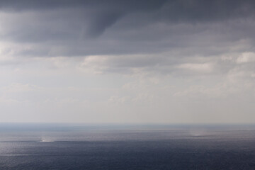 A stunning, mesmerizing view of the seascape, the dark black sea and cumulus thunderstorm large...