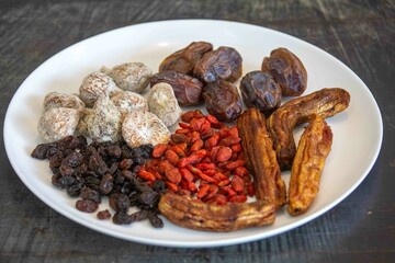 Group of dehydrated dried fruits, dates, goji berries, raisins, dried bananas and Turkish figs. Superfood
