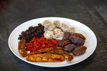 Group of dehydrated dried fruits, dates, goji berries, raisins, dried bananas and Turkish figs. Superfood