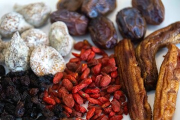 Group of dehydrated dried fruits, dates, goji berries, raisins, dried bananas and Turkish figs. Superfood