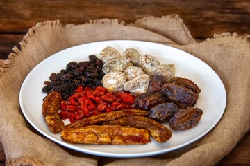 Group of dehydrated dried fruits, dates, goji berries, raisins, dried bananas and Turkish figs. Superfood