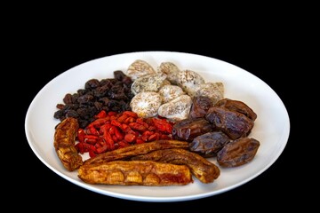 Group of dehydrated dried fruits, dates, goji berries, raisins, dried bananas and Turkish figs. Superfood