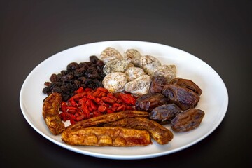 Group of dehydrated dried fruits, dates, goji berries, raisins, dried bananas and Turkish figs. Superfood
