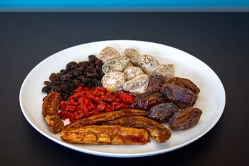 Group of dehydrated dried fruits, dates, goji berries, raisins, dried bananas and Turkish figs. Superfood