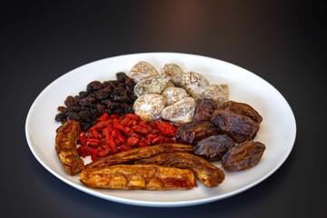 Group of dehydrated dried fruits, dates, goji berries, raisins, dried bananas and Turkish figs. Superfood