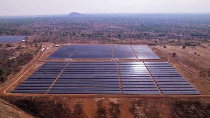 Fotobehang Afrika Renewable Energy, Drone Shot of African solar power plant in arid landscape in Ghana.  © Roger