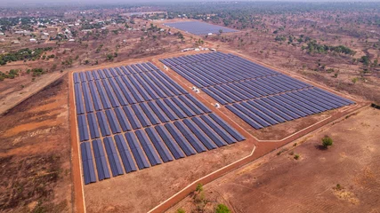 Fotobehang Afrika Renewable Energy, Drone Shot of African solar power plant in arid landscape.  © Roger