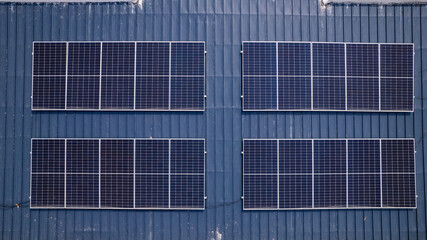 Renewable clean energy, modern rooftop solar panels installation in residential neighbourhood. © Roger
