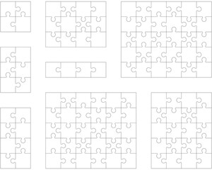 Separate pieces of eight white jigsaw puzzles 
