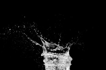 Captivating Water Splash: The image captures a stunning water splash with delicate droplets suspended mid-air, emphasizing movement and refreshing purity.
