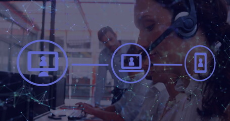 Using headset, customer service representative assisting on computer in modern office