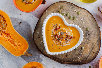 Traditional autumn butternut squash soup with seeds.