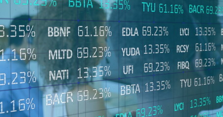 Obraz premium Stock market data reflecting on glass wall in modern office environment