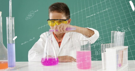 Young scientist in school conducting chemistry experiment with colorful liquids