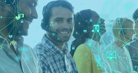Smiling customer service team using headsets with digital interface overlay