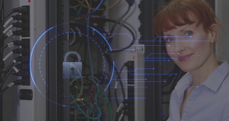 Smiling woman in server room working on cybersecurity with digital lock interface