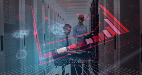 Technicians in server room analyzing data with digital graphs overlay