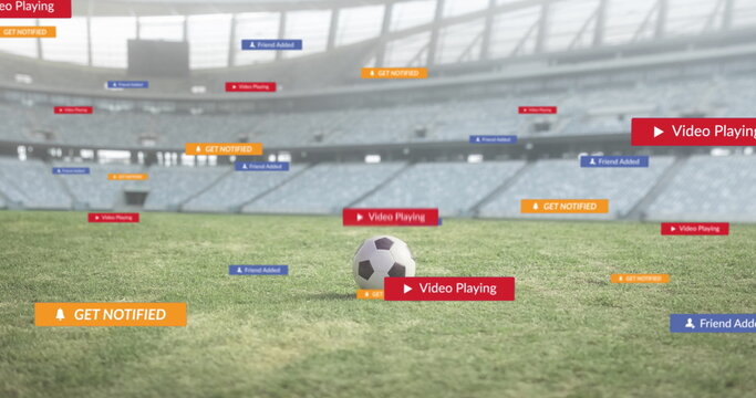 Image of social media icons on banners over football on pitch