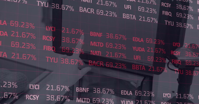 Digital image of stock market data processing against mid section of person using digital tablet