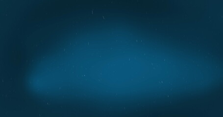 Digital image of white particles falling against blue background