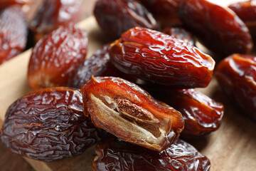 Many tasty dried dates on table, closeup