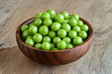a wooden bowl full of green peppercorn spheres lies on a wood plane  
