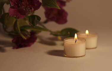 Soft focus smoke blur Burning Candles in dark. Evening, night Light and shadow beige background. Minimalist still life.