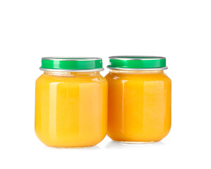 Baby food. Tasty puree in glass jars isolated on white