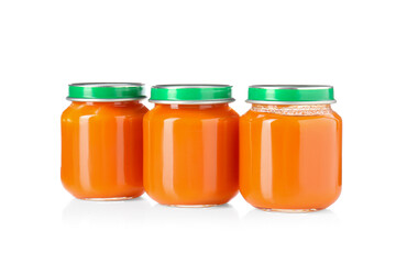 Baby food. Tasty puree in glass jars isolated on white