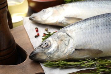 Salted herrings and spices on table, closeup