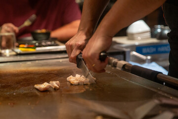 Slicing Chicken on Habachi Grill