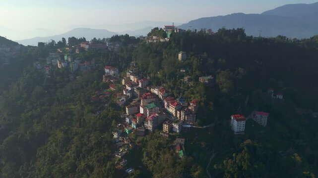 Aerial, drone shot 4k. Aerial view of the foggy day in Pelling, Sikkim. Northern India. Indian Mountain. D Log. Bird eye View. Travelling Northeast Video. Indian mountain village. IN front of Skywalk.