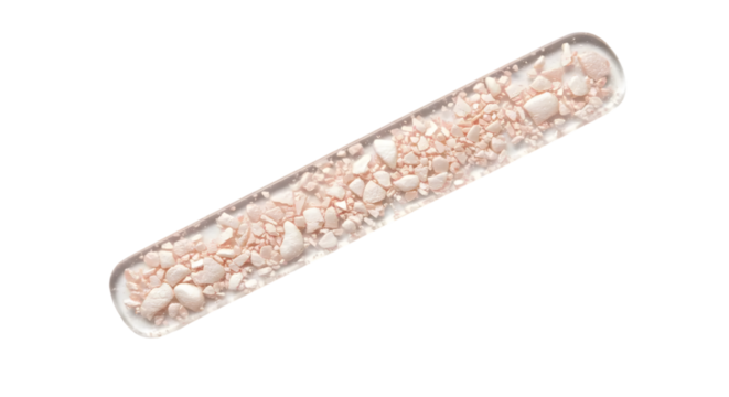 Close-up View of White and Pink Granules in a Transparent Test Tube for Scientific Research and Laboratory Purposes