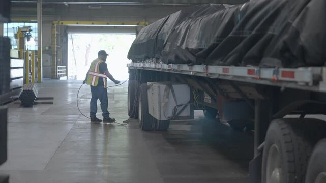Trucker securing cargo load