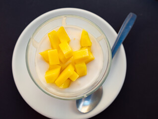 Sweet whipped mango mousse served in bowl for dessert