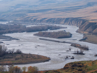 Scenic river winding through a tranquil valley landscape