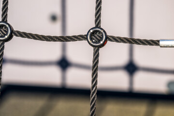 rope climbing net connection in outdoor playground.