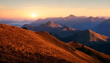 Fototapeta premium Mountain ranges and hills of forests and lakes during golden hour and a bright sky