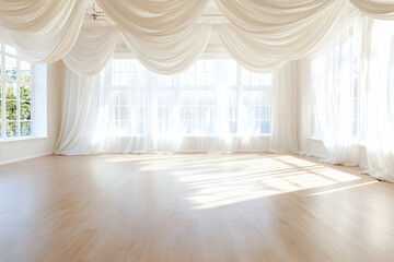 Sunlit studio room with flowing drapes and hardwood floor