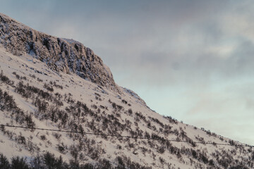 Blue sky and clouds behind Saana Fell summit in Kilpisjarvi in Finnish Lapland.