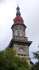 Building with a tower and red dome surrounded by trees in Buenos Aires, Argentina