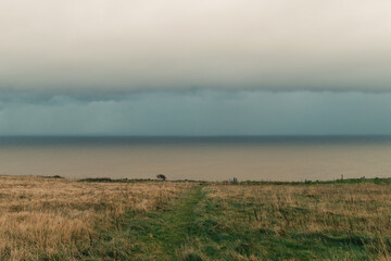 Naklejka premium View of heavy clouds from a cliff