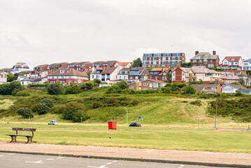 Hillside residential district in England on a cloudy summer day