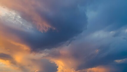 Dramatic Storm Clouds Illuminated by Vibrant Sunset Over Open Landscape