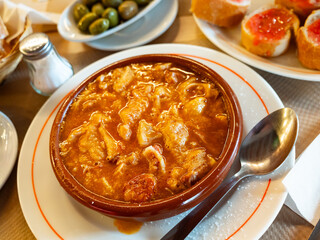 Appetizing beef tripe served with sauce in bowl